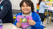 Juan shows off the final product, his beautiful video game-themed valentine.