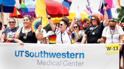 UT Southwestern participants get the crowd fired up with a chant at the Dallas Pride Parade.