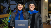 Ambar Cajigas Hernandez, Ph.D., is all smiles after receiving her degree, standing beside her mentor, Weichun Lin, Ph.D., Professor of Neuroscience.