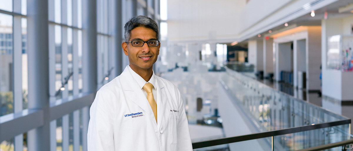 Man with glasses in lab coat