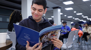 A high school student looks through a brochure at a Health Professions Recruitment and Exposure Program  (HPREP) event in January. HPREP exposes students to medicine and science career opportunities through activities that include participation in a college fair and mentorship with UT Southwestern students.