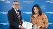 Farzin Ahmed, a Clinical Research Coordinator II in Anesthesiology & Pain Management, receives her award for Best Research Billing Compliance from Bhanu P. Pappu, Ph.D., M.H.A., Associate Vice President, Clinical Research Services.