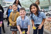 From left: Emma Gonzalez, Kristopher Bosse, and Ethan Vera are all smiles as they tour the Center.