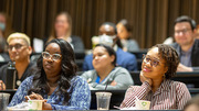 Event attendees take in the panelists’ responses.