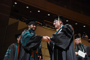 Dr. James Wagner congratulates a graduating medical student.
