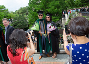 Students pack McDermott Plaza after the ceremony and document the day in photos.