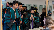 From left: Nidhish Lokesh, M.D., Noah Collaco, M.D., and Annie He, M.D., check in for the commencement ceremony.