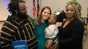 Dr. Prokesch (center), holding the young patient who became her namesake, along with parents Dylan and Paula Warren.