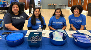 UTSW employees share informational pamphlets and portion plates in support of health at the Fort Worth event.