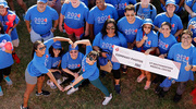 Walkers form a heart at the front of the group photo.