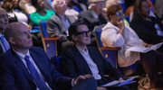 Institutional Service Award honorees Jonathan Dowell, M.D., and Heidi Jacobe, M.D., watch the stage before their category is announced.