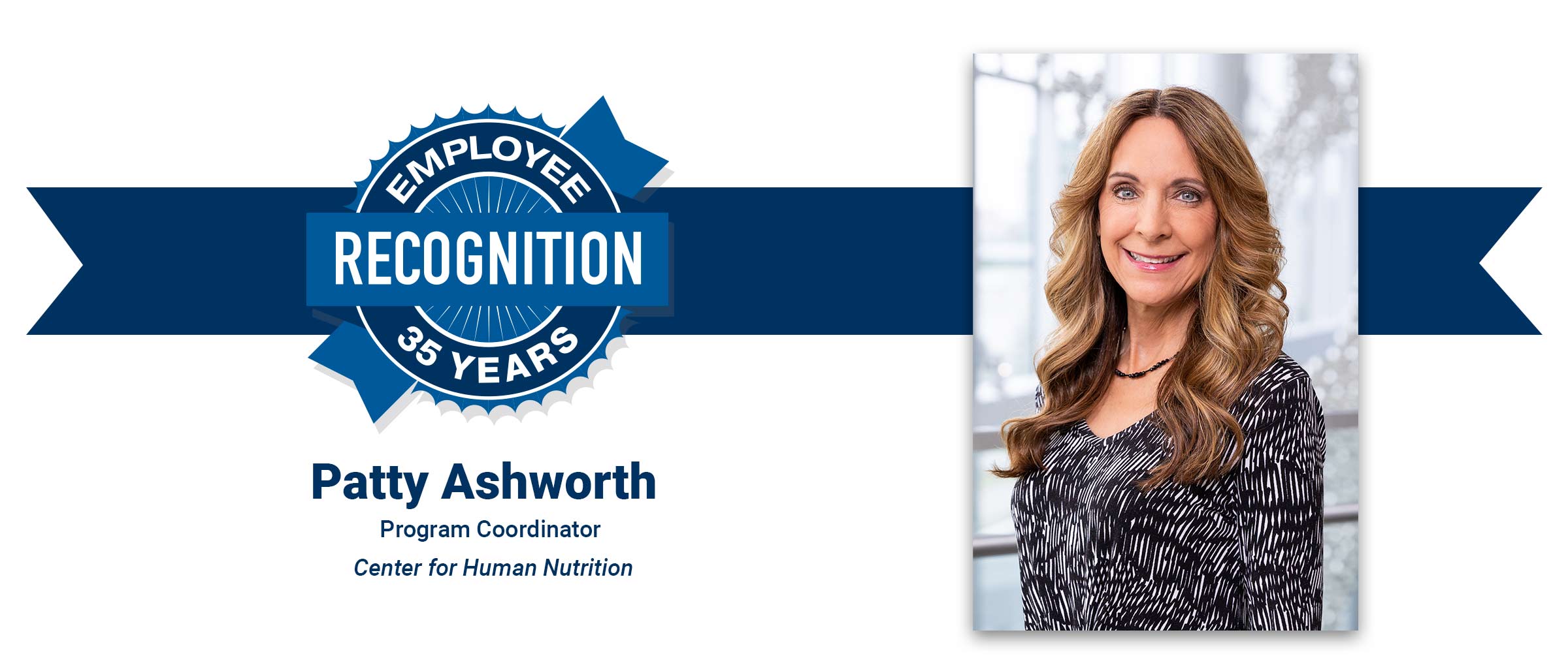 Woman with long brown hair, wearing black and white patterned shirt. Patty Ashworth, 35 years employee recognition.