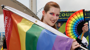 Vivid flags and fans spotlight the day’s celebrations.