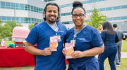 It’s popcorn o’clock for Ryan Varghese (left) and Sharon Mosley-McMiller.