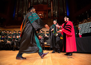 Dr. Andrew Austin receives his diploma.