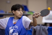 Table tennis player returns a serve