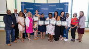Business Affairs leaders and others are pictured with Latasha Stevenson, one of two Platinum recipients, and Gold pin recipients representing Business Affairs.