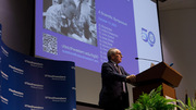 Dr. Podolsky welcomes a packed audience to the Tom and Lula Gooch Auditorium to celebrate the research partnership of Drs. Brown and Goldstein.