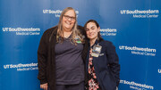 Mother and daughter duo Mary and Sara Garcia (left to right) pause for PACT pin photo opp. Mary is an RN Unit Based Educator and Sara is a Critical Care Nurse on 7 Blue ICU.