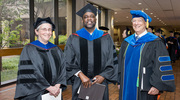 Joan Conaway, Ph.D., Vice Provost and Dean of Basic Research; Russell DeBose-Boyd, Ph.D., Professor of Molecular Genetics and keynote speaker at commencement; and Andrew Zinn, M.D., Ph.D., Dean of the Graduate School, celebrate the momentous occasion.