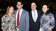 Dr. Butts and Dr. Davies celebrate the night with their wives, Blythe Butts and Emily Polito.