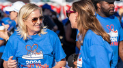 Susan Hernandez, D.N.P., M.B.A., RN, Vice President and Chief Nursing Executive, chats with an employee at the UTSW tent.