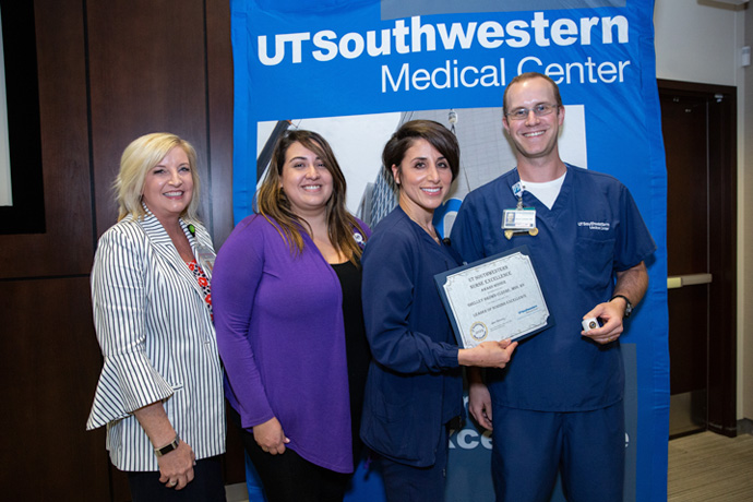 Shelley Brown-Cleere, Director of Neurosciences Services, wasn’t present to receive her Leader of Nursing Excellence award, but her colleagues accepted it on her behalf. Pictured, from left: CNE Susan Hernandez, Alexa Collins, NSICU Assistant Nurse Manager, Julie Greer, Nurse Manager, and Byron Carlisle, NSICU Nurse Manager.