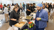 Members of the UTSW community and guests line up for cuisine that represents staple food historically served at Juneteenth festivities across Texas.