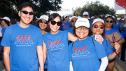 A group of walkers stops to pose for the camera as they join thousands along the walk.