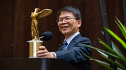 At a UT Southwestern reception, Zhijian “James” Chen, Ph.D., holds the Albert Lasker Basic Medical Research Award he received, an honor often called “America's Nobels” that is regarded as the country’s preeminent biomedical research prize. Dr. Chen received the award for his discovery of the cGas enzyme, which senses invading pathogens and triggers the body’s innate immune system.