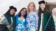 Chinmayee Venkatraman, M.D. (left), and Julia Casazza, M.D. (right), are joined by their proud families.