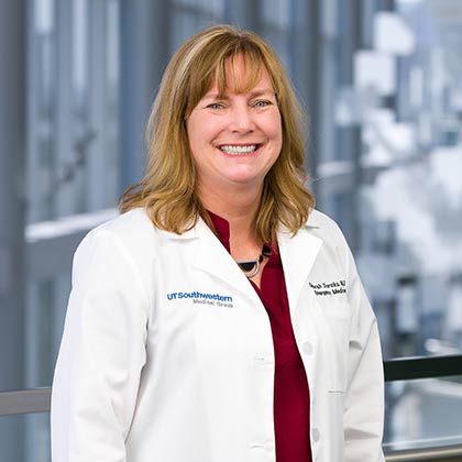 woman in white lab coat