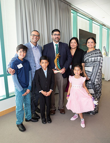 Dr. Tambar, surrounded by his family, poses with his Hackerman Award.