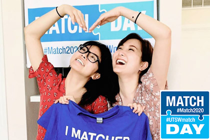 Two women smiling with an I matched shirt
