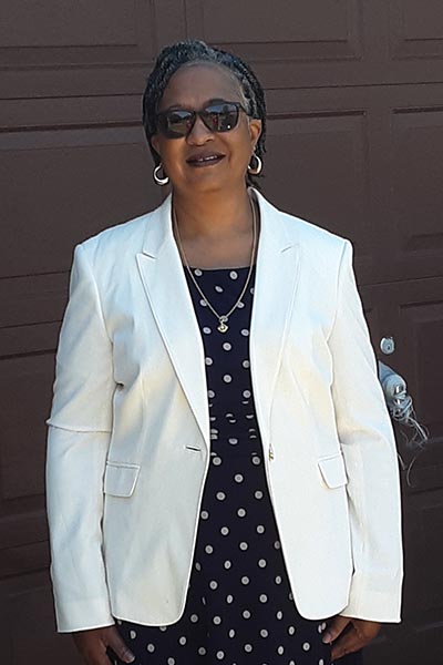 Woman in white suit jacket
