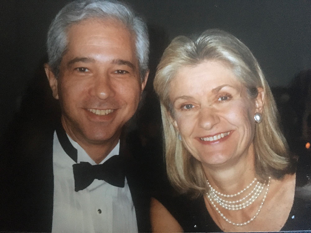 Man and woman in formal wear smiling