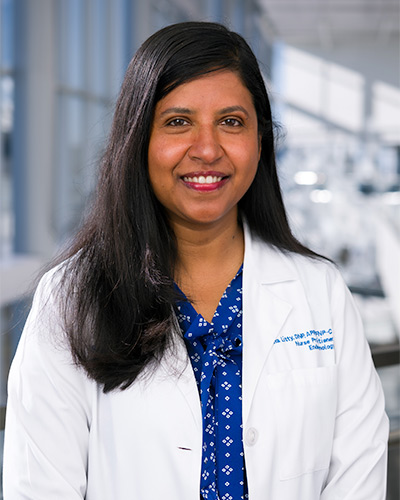 Woman in white lab coat