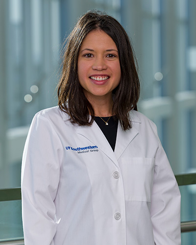 Woman in white lab coat