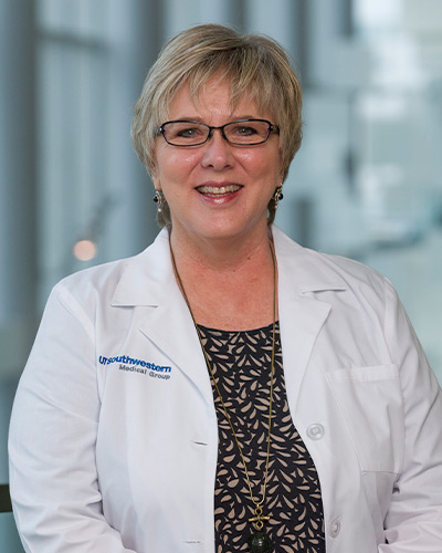 Woman in white lab coat