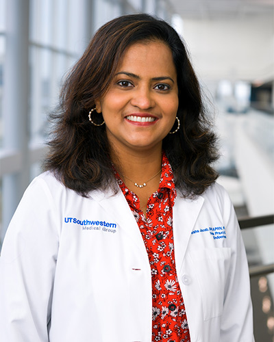 Woman in white lab coat