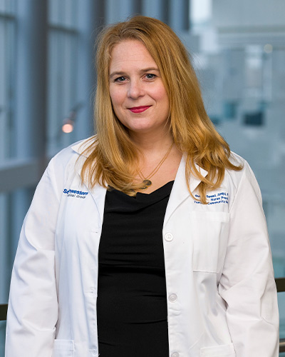 Woman in white lab coat