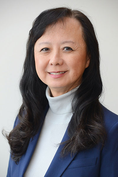 headshot of Dr. Sherry Huang; Asian woman in blue blazer and white shirt with long black hair