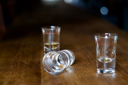 dark table with 2 shot glasses