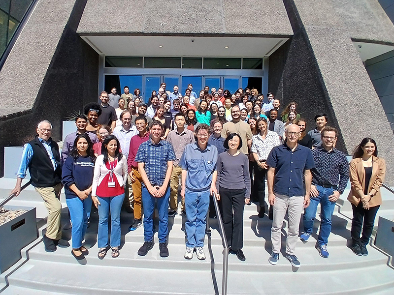 The Cell Biology faculty gather on the steps of a modern building for a group photo.