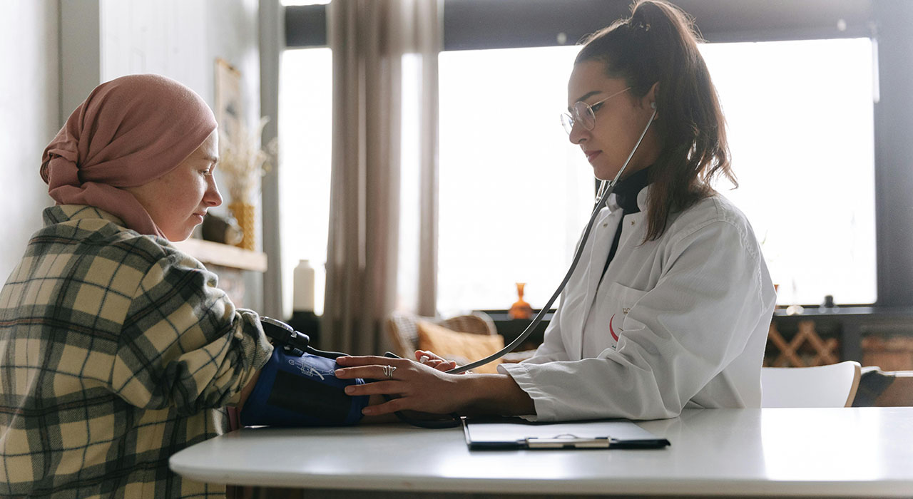 Student examining patient