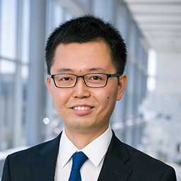 Dr. Zhao Zhang wearing a dark suit and tie