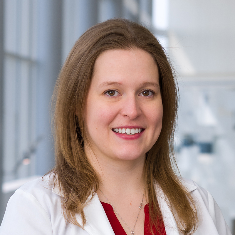 Dr. Jenny Riecke wearing a white lab coat