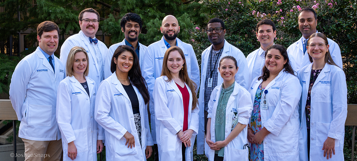 a group of doctors in an outdoor setting 