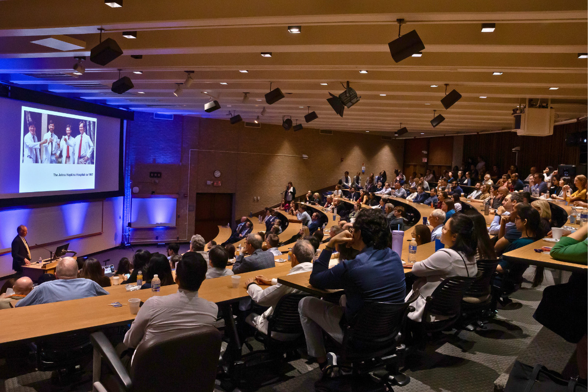 Dr. William Kaelin presenting infront of an audience