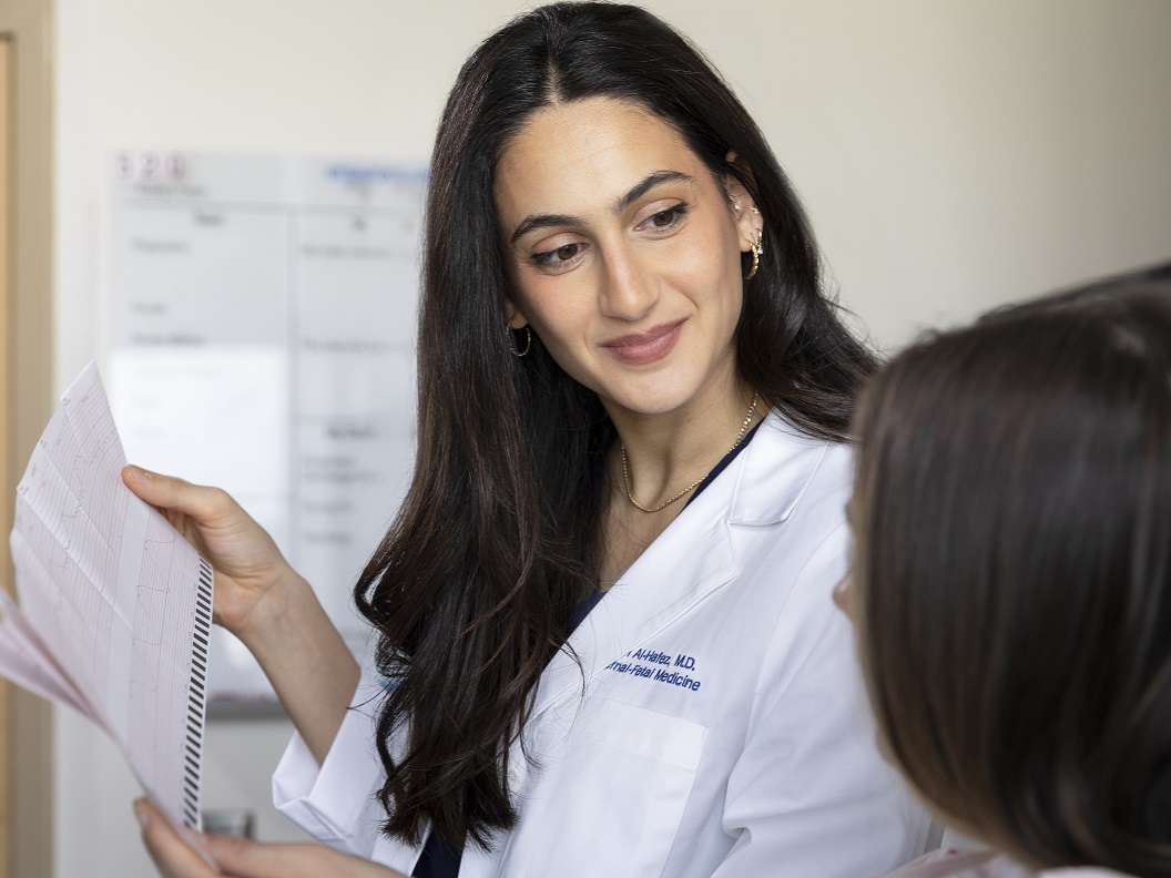 A photo of a doctor reviewing paperwork